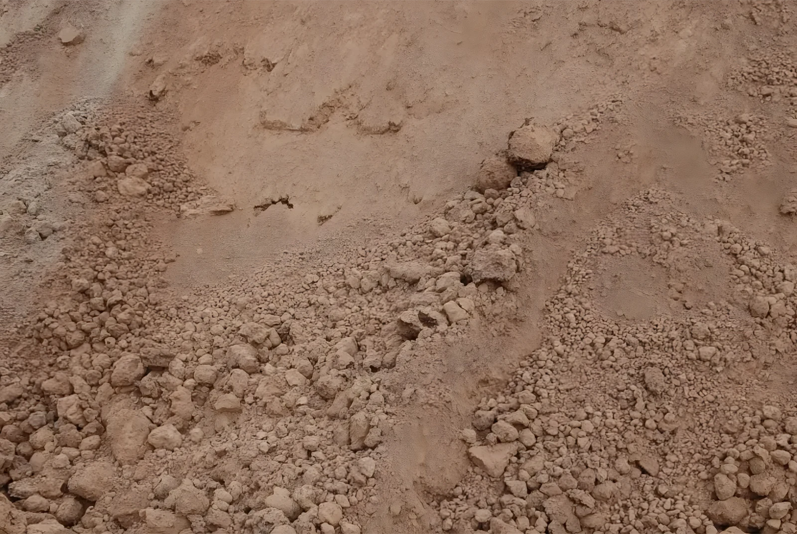Compacted select fill material for structural building pads